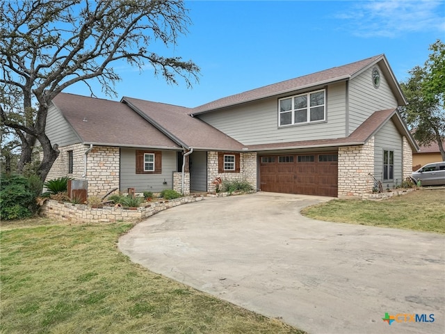 view of front of property featuring a garage and a front lawn