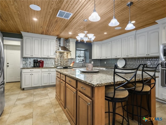 kitchen with white cabinets and a center island