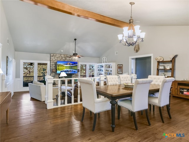 dining space featuring ceiling fan with notable chandelier, dark hardwood / wood-style flooring, beamed ceiling, and a healthy amount of sunlight