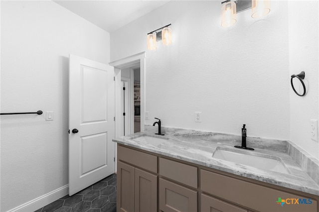 bathroom featuring vanity and tile patterned flooring