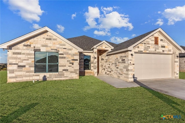 126 Overlook Trl, Copperas Cove, TX 76522 - view of front of house with a front yard, concrete driveway, a garage, and stone siding