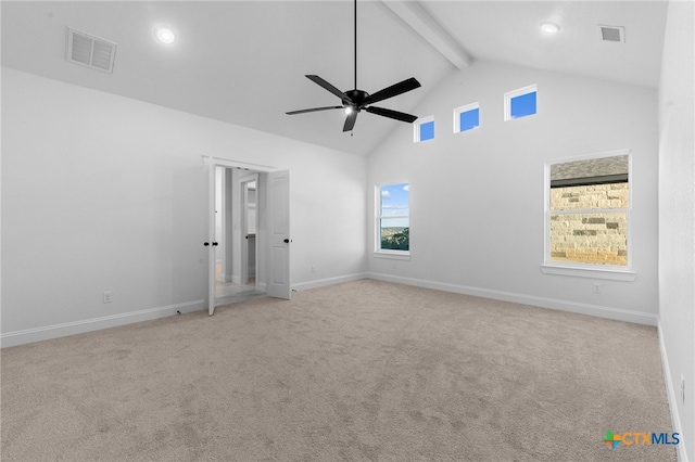 carpeted empty room with ceiling fan, beam ceiling, and high vaulted ceiling