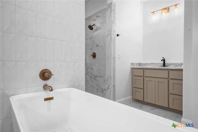 bathroom with tile walls, independent shower and bath, and vanity