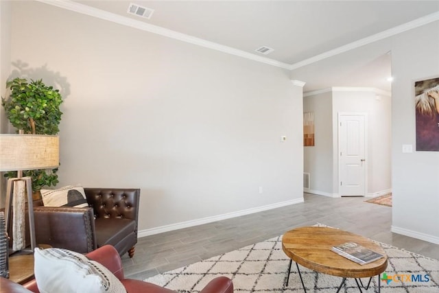 living room featuring light hardwood / wood-style floors and ornamental molding