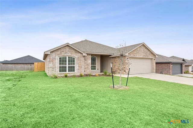 single story home featuring a garage and a front yard