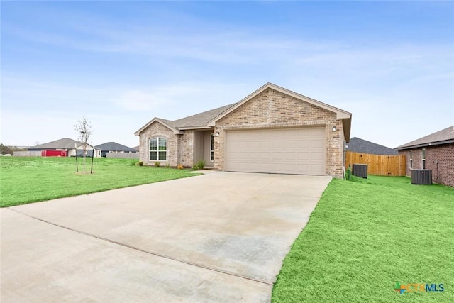 ranch-style home with a front yard, central AC, and a garage