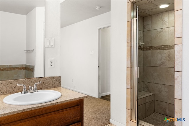 full bathroom with vanity and a shower stall