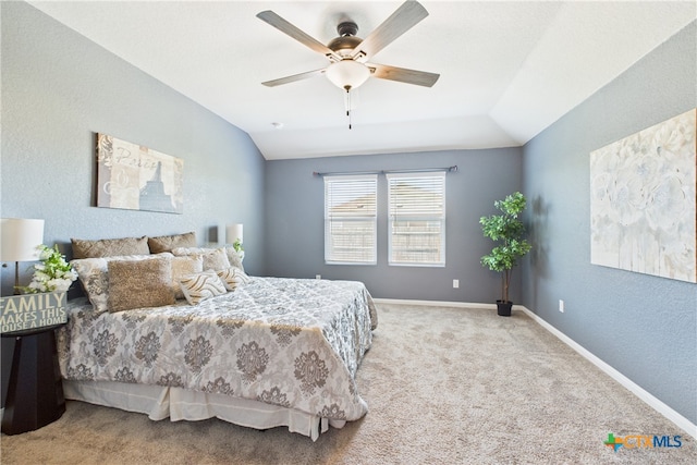 bedroom featuring baseboards, vaulted ceiling, ceiling fan, and carpet