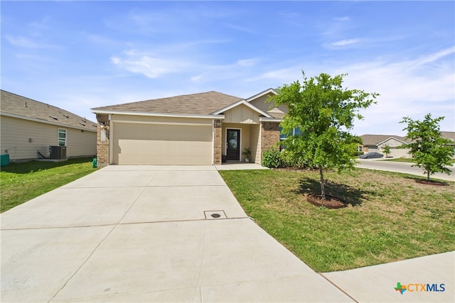 single story home featuring a garage, driveway, a front yard, and brick siding