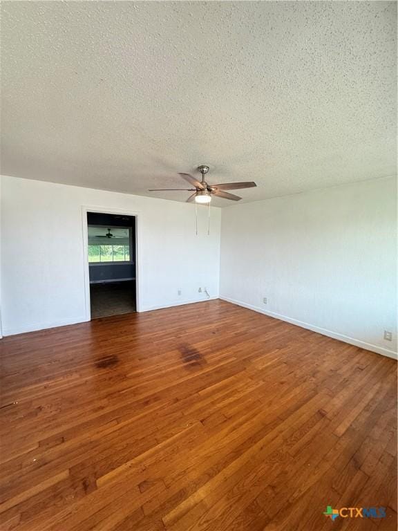 2310 Terrace Dr, Killeen, TX 76543 - unfurnished room featuring wood finished floors, a textured ceiling, and a ceiling fan