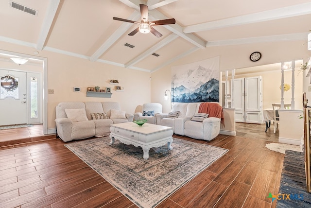 living room featuring ceiling fan, dark hardwood / wood-style floors, and lofted ceiling with beams