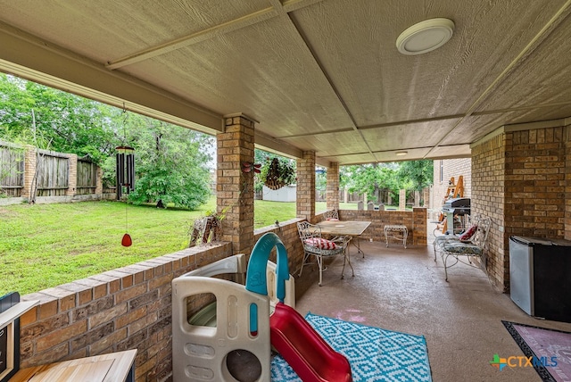 view of patio featuring a grill