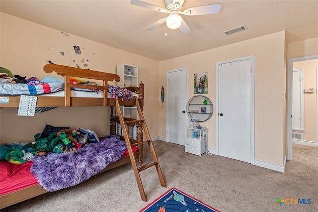 bedroom featuring ceiling fan and light colored carpet