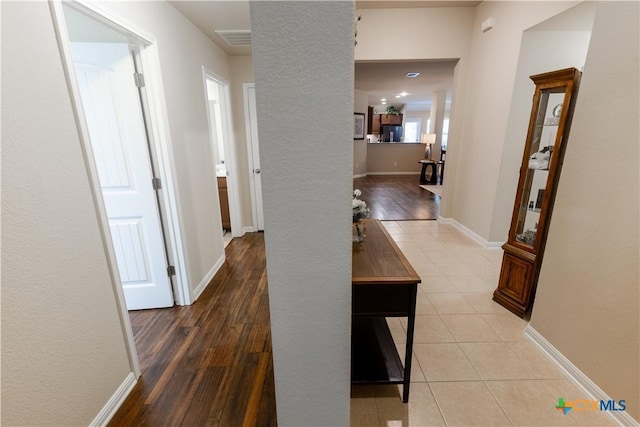 hallway featuring wood-type flooring