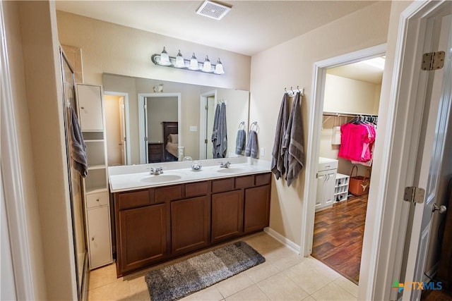 bathroom with vanity and hardwood / wood-style flooring