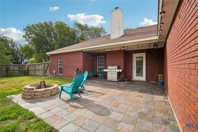 view of patio featuring grilling area and an outdoor fire pit