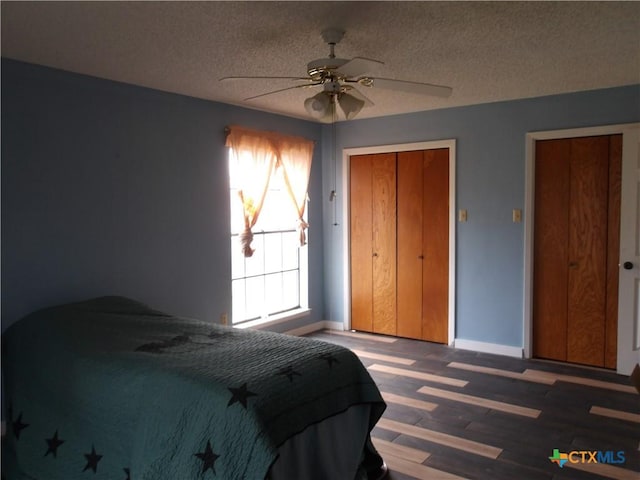 bedroom with baseboards, ceiling fan, wood finished floors, a textured ceiling, and a closet