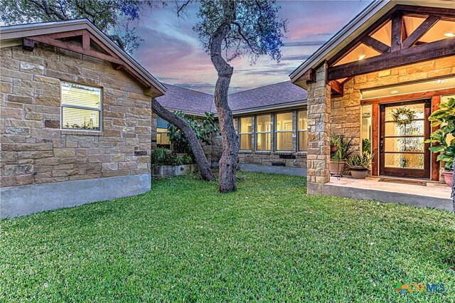 1002 Merry Ln, Kingsland, TX 78639 - yard at dusk featuring a yard