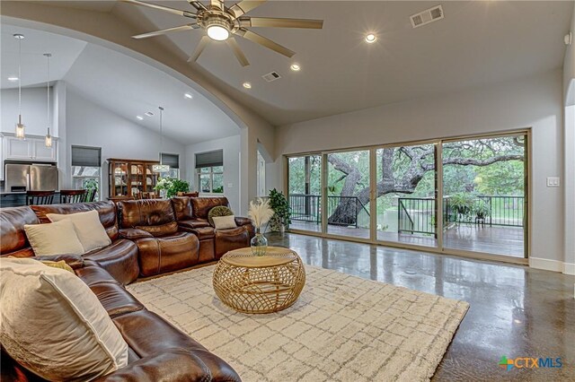 1002 Merry Ln, Kingsland, TX 78639 - living room with arched walkways, ceiling fan, high vaulted ceiling, recessed lighting, and finished concrete floors