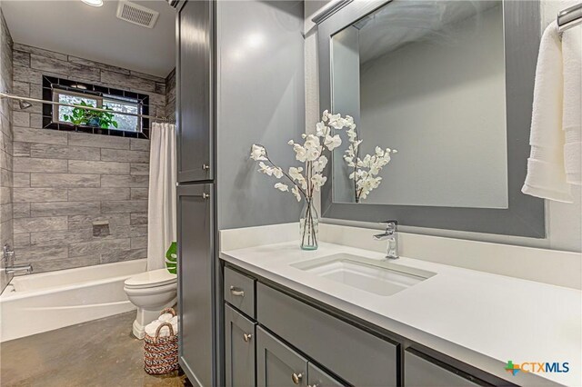 1002 Merry Ln, Kingsland, TX 78639 - full bathroom featuring vanity, shower / bath combo with shower curtain, and finished concrete flooring