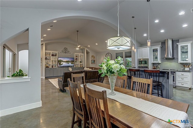 1002 Merry Ln, Kingsland, TX 78639 - dining area with finished concrete flooring, vaulted ceiling, recessed lighting, a ceiling fan, and arched walkways