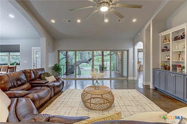 1002 Merry Ln, Kingsland, TX 78639 - living room featuring arched walkways, a ceiling fan, recessed lighting, and finished concrete floors