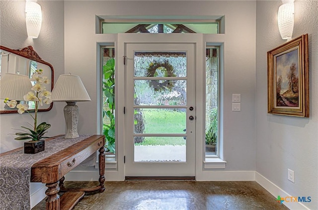 1002 Merry Ln, Kingsland, TX 78639 - entrance foyer with healthy amount of natural light and concrete floors