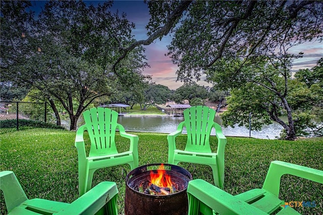 1002 Merry Ln, Kingsland, TX 78639 - view of yard with a fire pit and a water view