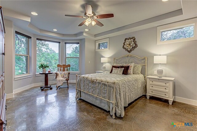 1002 Merry Ln, Kingsland, TX 78639 - bedroom featuring a raised ceiling, recessed lighting, concrete flooring, and ceiling fan
