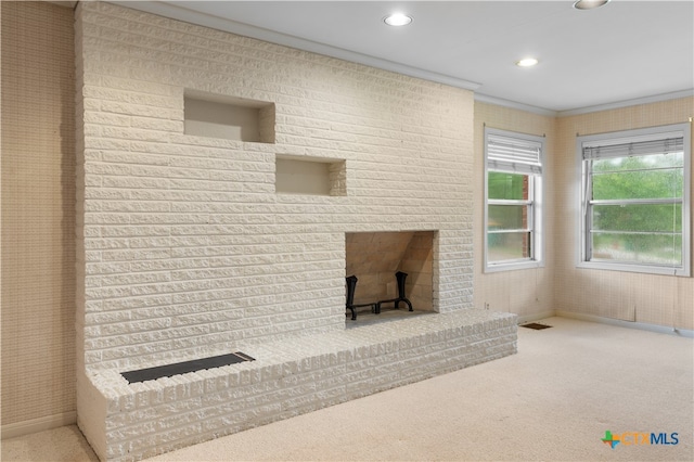 carpeted living room with ornamental molding