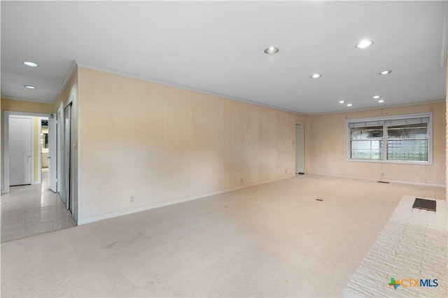 701 Live Oak St, Gatesville, TX 76528 - carpeted spare room featuring recessed lighting and crown molding