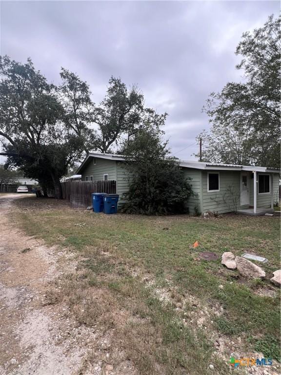 728 W Franklin St, Goliad, TX 77963 - view of home's exterior featuring a yard