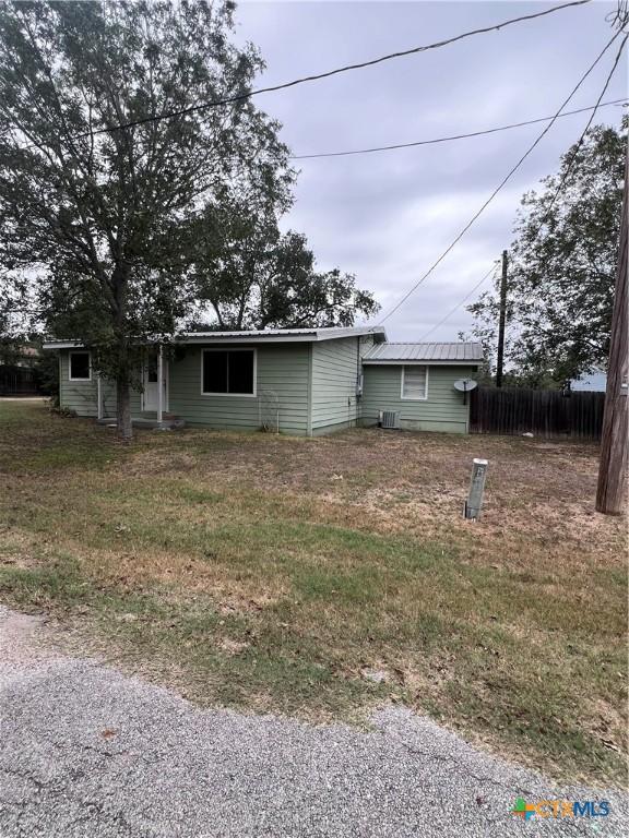 728 W Franklin St, Goliad, TX 77963 - view of home's exterior with metal roof