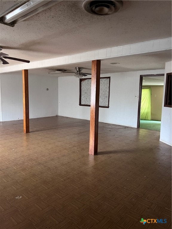 basement featuring ceiling fan