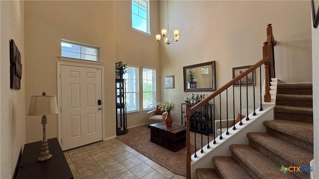 9516 Glynhill Ct, Killeen, TX 76542 - foyer with a healthy amount of sunlight, light tile patterned floors, a towering ceiling, and stairs