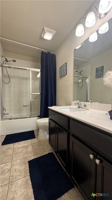 9516 Glynhill Ct, Killeen, TX 76542 - full bath with visible vents, toilet, enclosed tub / shower combo, vanity, and tile patterned floors
