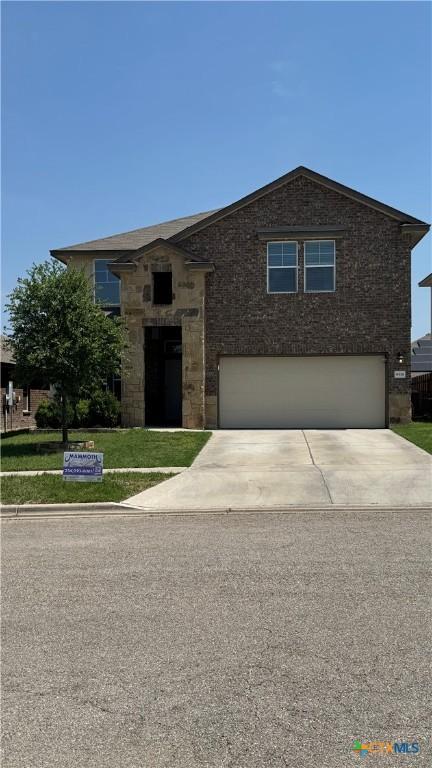 9516 Glynhill Ct, Killeen, TX 76542 - view of front of property featuring a front yard, an attached garage, and concrete driveway