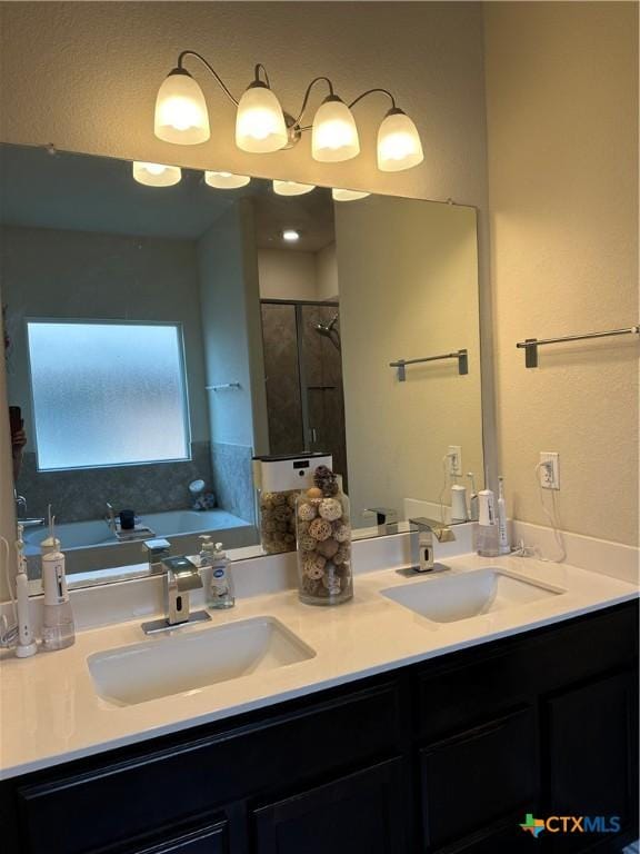 9516 Glynhill Ct, Killeen, TX 76542 - bathroom with a sink, a shower stall, double vanity, and a garden tub