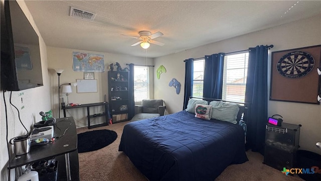 9516 Glynhill Ct, Killeen, TX 76542 - bedroom featuring carpet flooring, visible vents, a textured ceiling, and ceiling fan