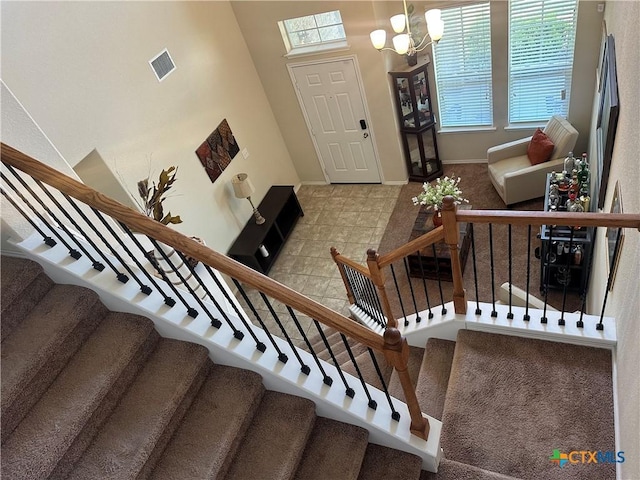 9516 Glynhill Ct, Killeen, TX 76542 - stairway with visible vents, baseboards, an inviting chandelier, and carpet floors