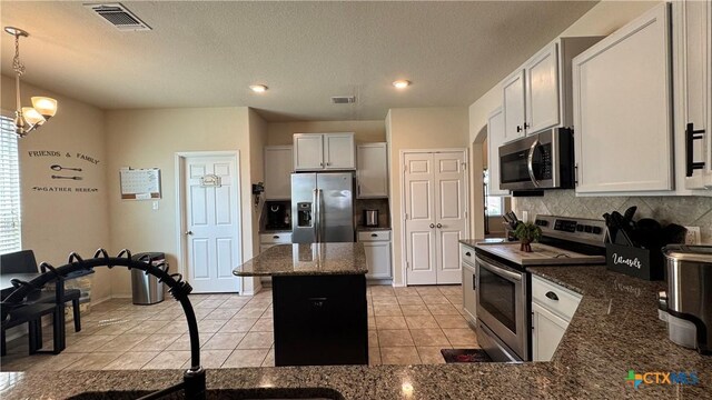9516 Glynhill Ct, Killeen, TX 76542 - kitchen featuring decorative backsplash, light tile patterned floors, visible vents, and stainless steel appliances