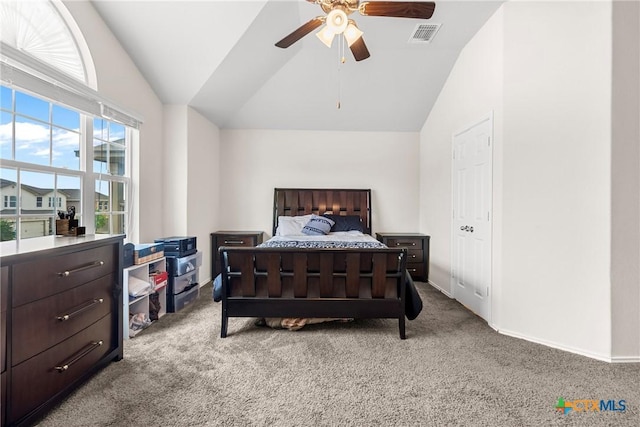 bedroom featuring lofted ceiling, carpet, visible vents, and baseboards