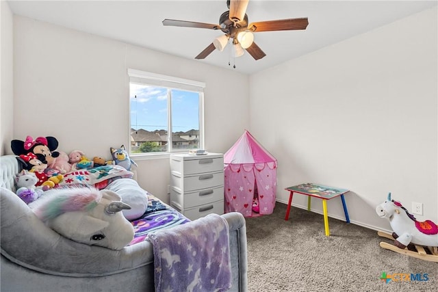 bedroom featuring ceiling fan and carpet floors