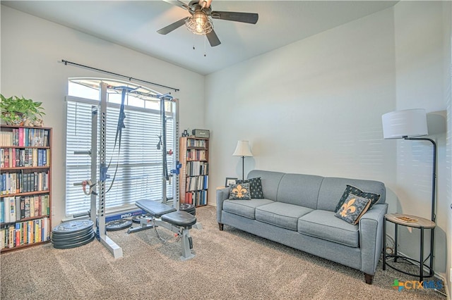 living room featuring carpet flooring and ceiling fan