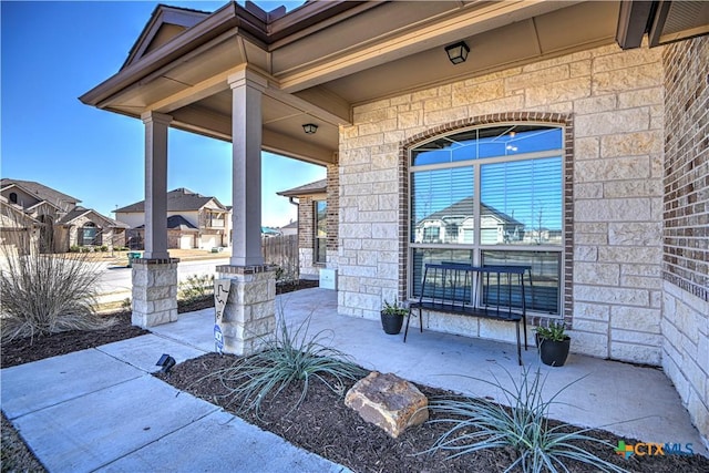 view of patio with a residential view and covered porch