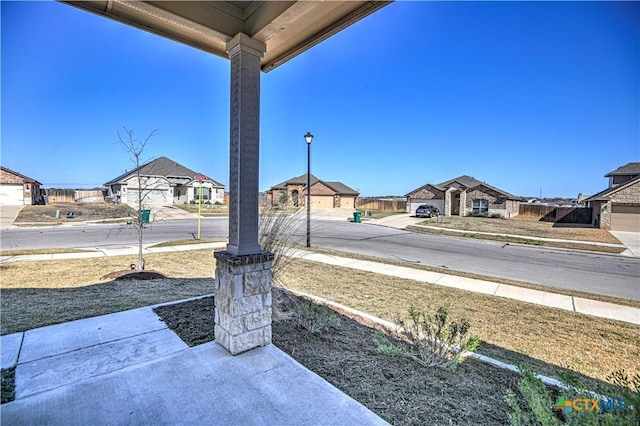 view of yard featuring a residential view