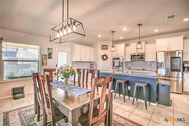 dining area featuring light tile patterned floors, visible vents, recessed lighting, and lofted ceiling