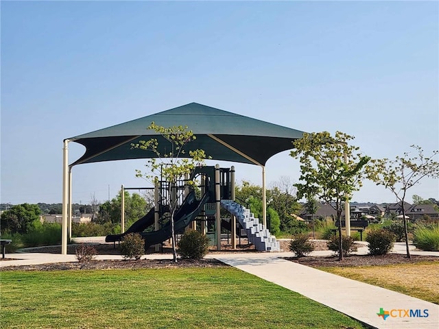 community jungle gym with a yard