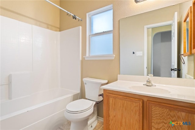 full bathroom with toilet, vanity, and  shower combination