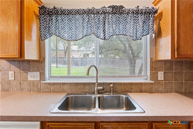 kitchen with backsplash and sink